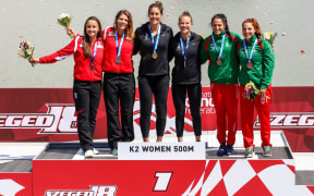 New Zealand kayakers Kayla Imrie and Lisa Carrington after receiving gold medals in the K2 500 race