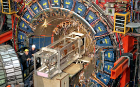TO GO WITH AFP STORY by Mira Oberman
In this undtated image release by Fermilab, Scientists work at the three-story, 6,000-ton CDF (Collider Detector at Fermilab) in the Fermi National Accelerator Laboratory (Fermilab), located just outside Batavia, Illinois, near Chicago.