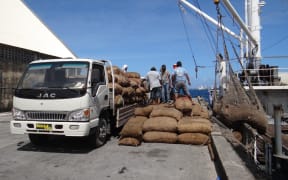 Bags of copra being offloaded for milling at the Tobolar Copra Processing Authority plant in Majuro.