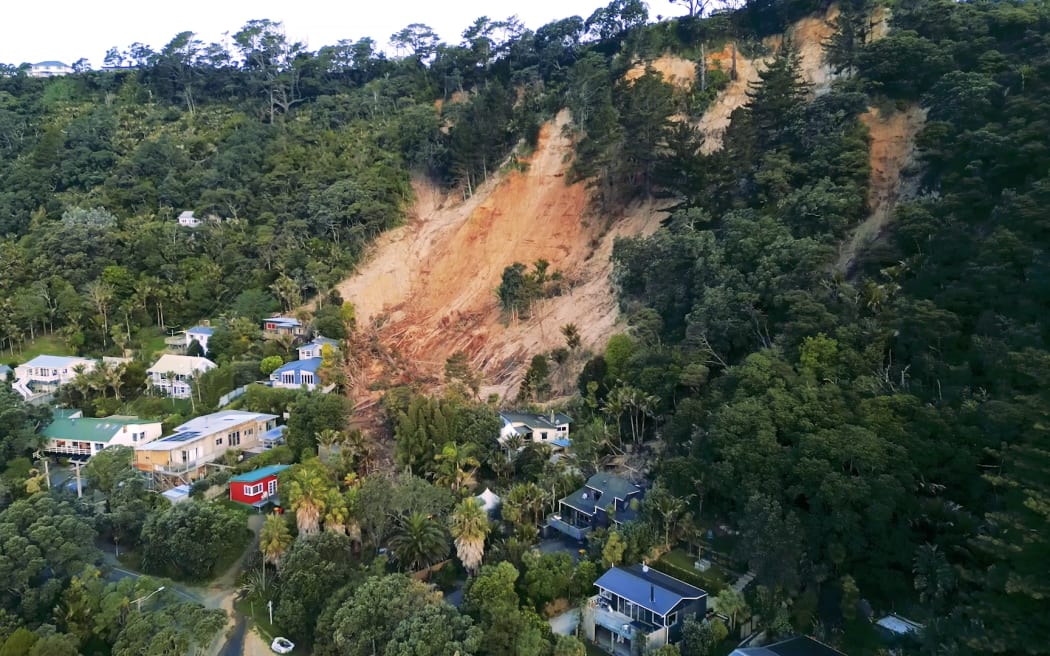 One of the land slips that has forced evacuations and red or yellow stickered homes at Muriwai.