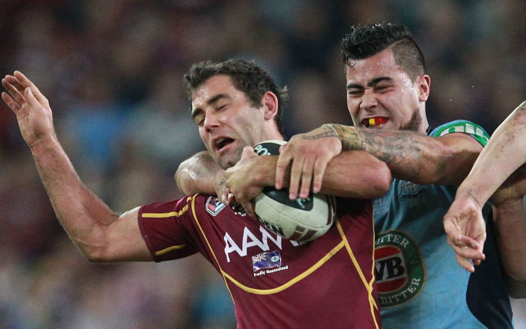 Queensland skipper Cameron Smith (left).