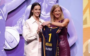 Caitlin Clark poses with WNBA Commissioner Cathy Engelbert after being selected first overall pick by the Indiana Fever during the 2024 WNBA Draft at Brooklyn Academy of Music on April 15, 2024 in New York City.