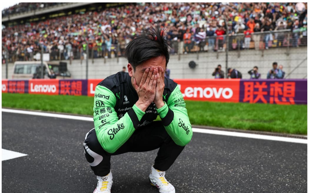 Kick Sauber's Chinese driver Zhou Guanyu reacts after the Chinese Formula One Grand Prix race at the Shanghai International Circuit in Shanghai, China, 2024.