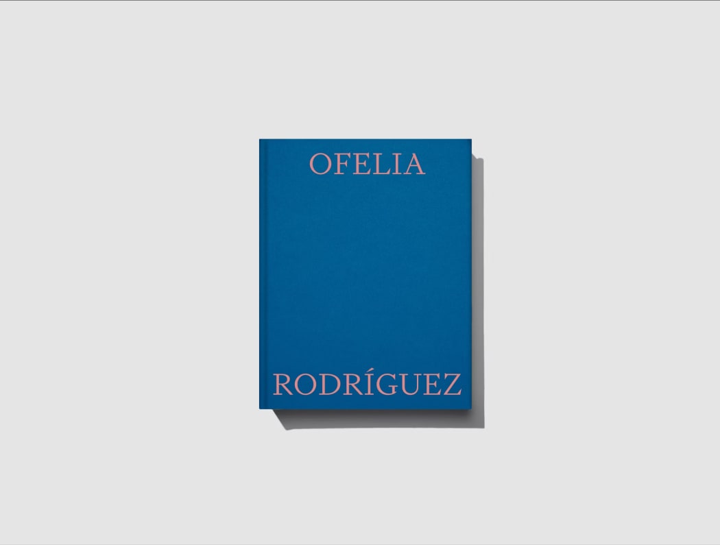 A blue art book with the name OFELIA RODRIGUEZ, in font designed by Klim.