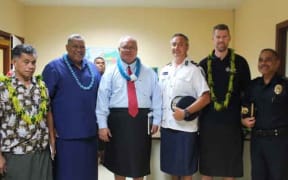 Two police commissioners in Center Le'i Sonny Thompson -Am Samoa and Fuiavailili Egon Keil-Samoa.  with AFP advisor Phil Eagles.