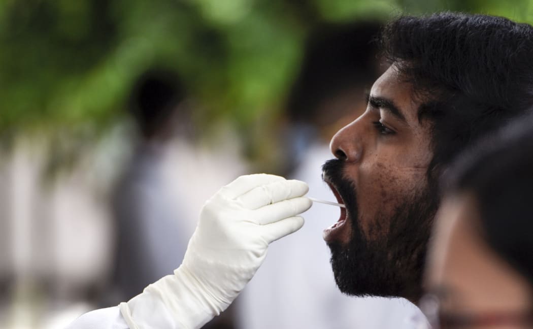Medics collect swab samples of staff and students of Gauhati Medical College and Hospital for COVID-19 test Guwahati, Assam, India on Friday, May 8, 2020.