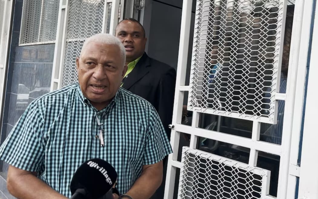 Frank Bainimarama left a Fiji police criminal investigations facility in handcuffs. (ABC News: Lice Movono)