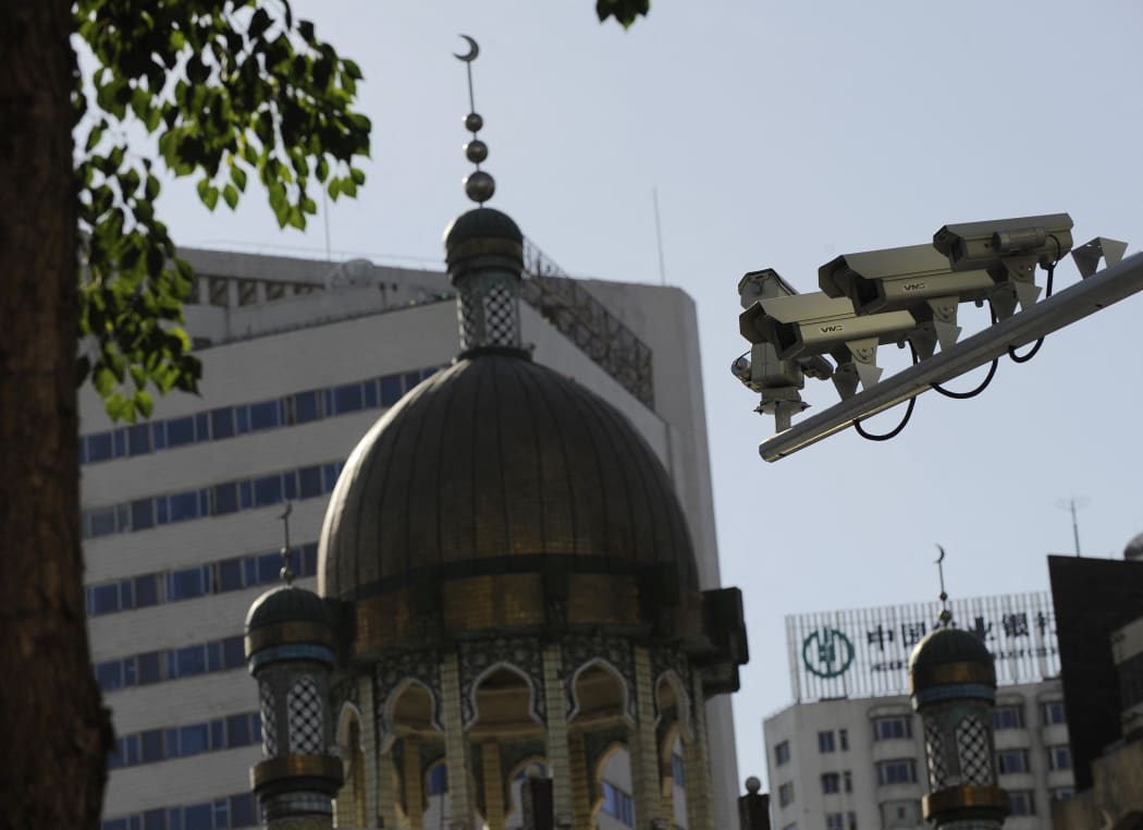 Security cameras are seen on a street in Urumqi, capital of China's Xinjiang region on July 2, 2010.