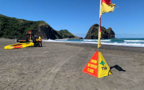 Surf lifesavers at Piha Beach
