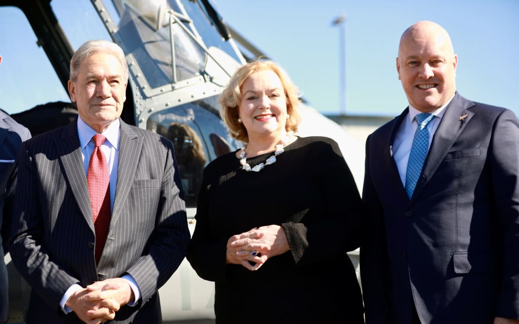 Defence Minister Judith Collins, Prime Minister Christopher Luxon and Deputy Prime Minister Winston Peters at the Royal New Zealand Air Force base in Auckland.