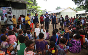 The WHO in PNG speaking to the community in Lae