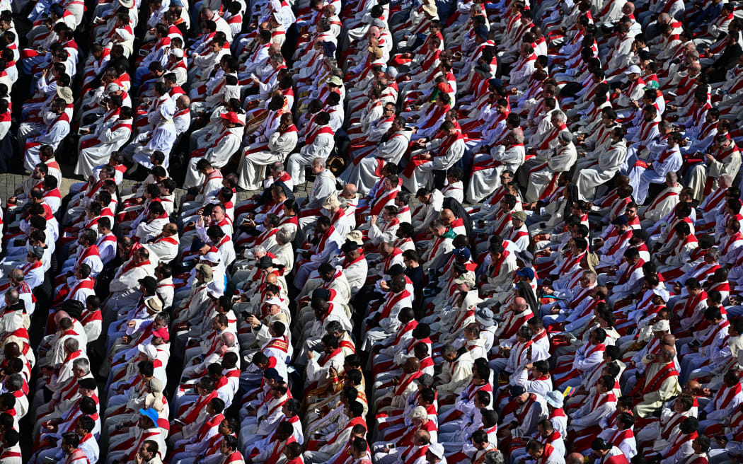 Members of the clergy wait for Pope Francis' funeral ceremony at St Peter's Square in The Vatican on April 26, 2025. (Photo by Tiziana FABI / AFP)
