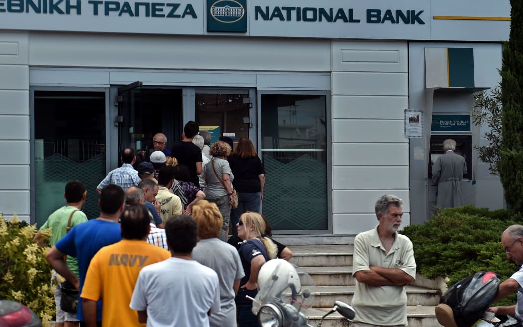 Greeks have been queuing to withdraw cash from banks.
