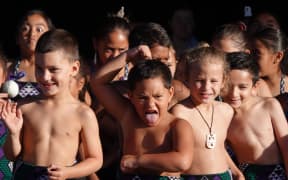 Boys from Te Kura Kaupapa Māori o Taumārere perform a haka.
