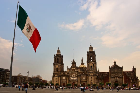 The Mexican flag flying near the cathedral in Mexico City.