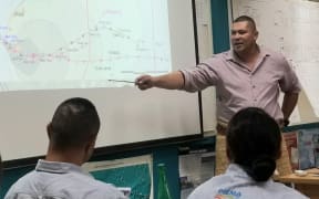Tonga's National Emergency Management Committee meet to discuss Tropical Cyclone Sarai.