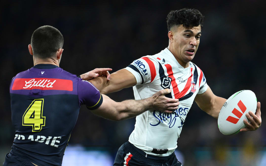 Nick Meaney of the Storm (left) and Joseph Suaalii of the Roosters.