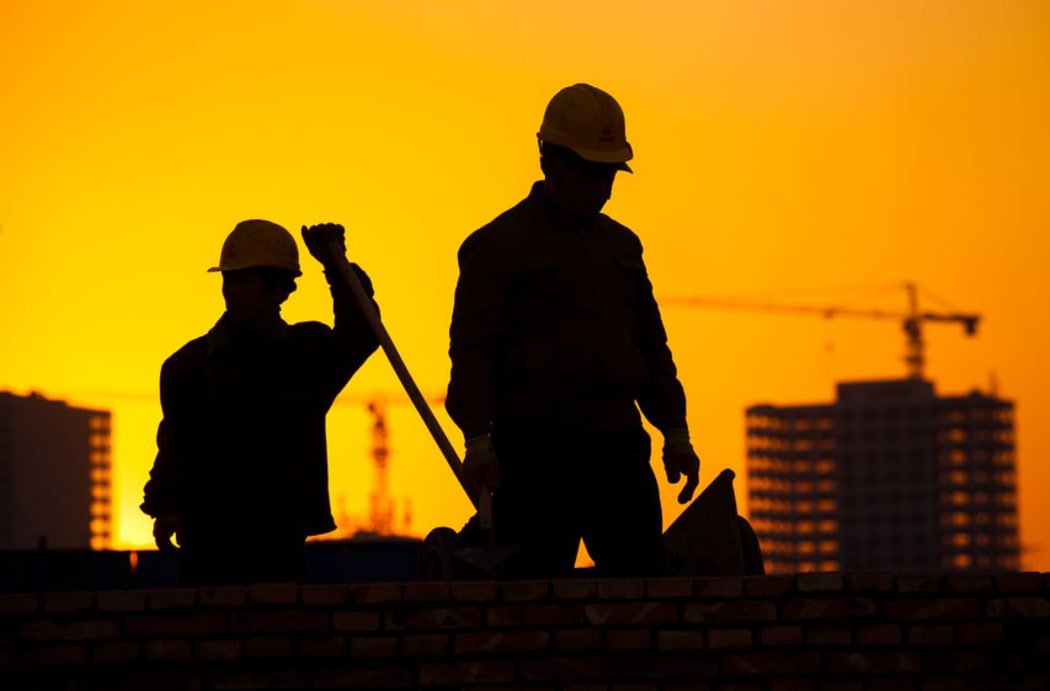 Silhouette of a construction worker.