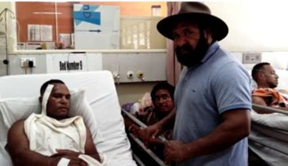 Papua New Guinea opposition leader Don Polye visits students who were injured in police shootings at the UPNG's Waigani campus.
