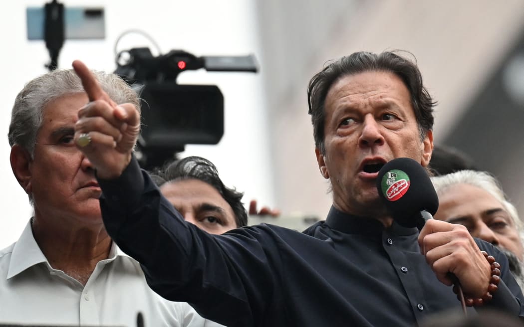 Pakistan's former prime minister Imran Khan addresses his supporters during an anti-government march towards capital Islamabad, demanding early elections, in Gujranwala on 1 November 2022.