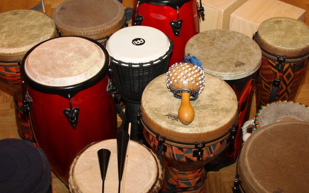 a selection of hand drums and shakers.