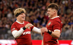 Henry Pollock (left) congratulates Lions teammate Dan Sheehan after scoring a try during their win over the Western Force in Perth.