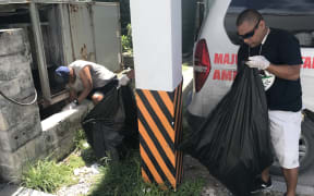 Ministry of Health staff led a grounds cleanup Saturday, August 17 to rid the main hospital of mosquito breeding locations.