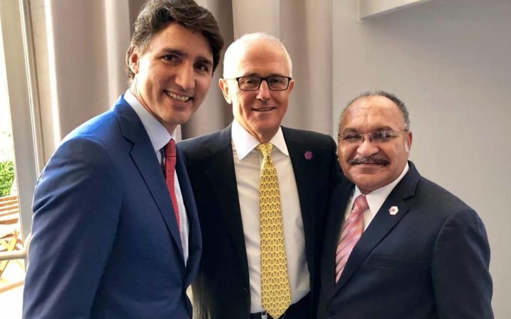 Canadian prime minister Justin Trudeau and Australian prime minister Malcolm Turnbull with Peter O'Neill.