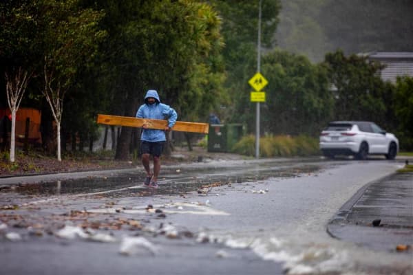 A person responds during Stokes Valley flooding.