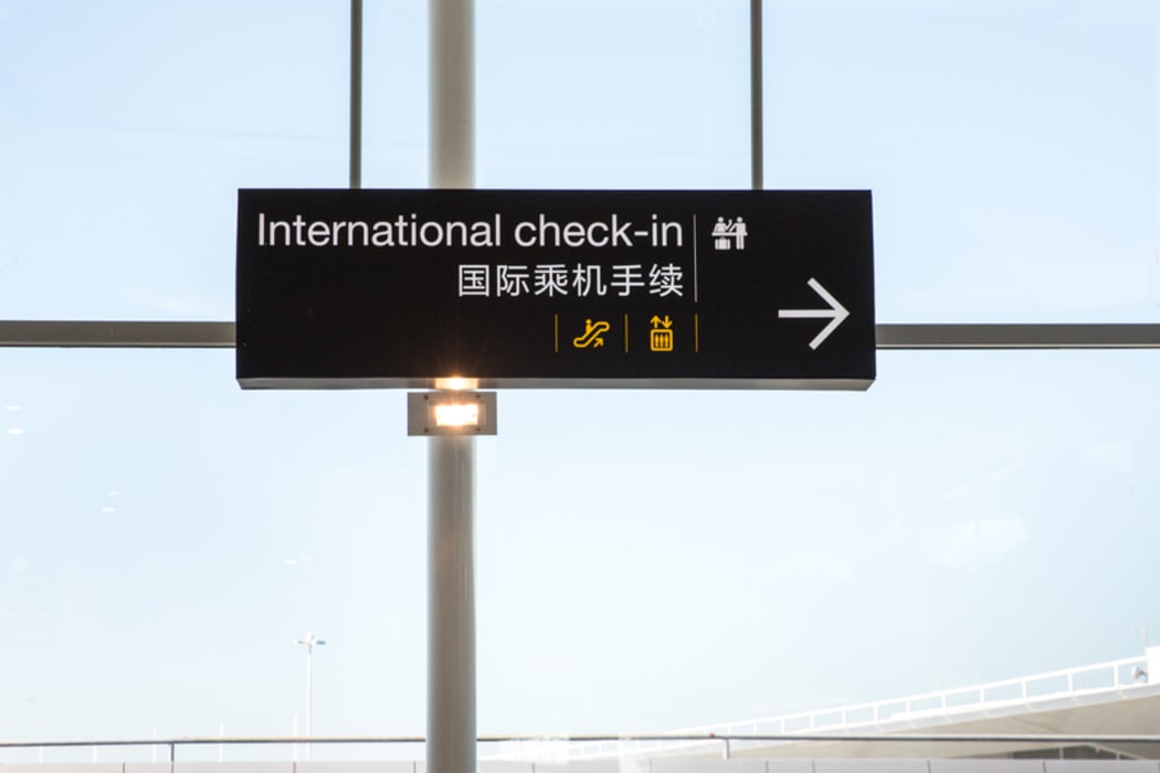 Signage for check-in at Auckland International Airport