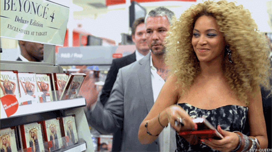 Beyonce chooses her DVDs off a shop shelf