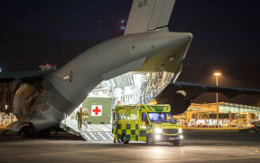 This handout photo taken on December 11, 2019 and released by the Royal Australian Air Force on December 12, 2019 shows a Royal Australian Air Force C-17A Globemaster in Christchurch prepareing to repatriate the Australians injured during the White Island volcanic eruption -