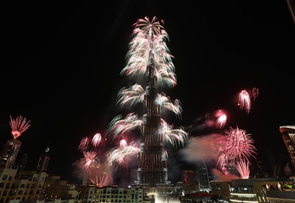 Fireworks explode from the Burj Khalifa.