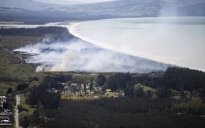 Canterbury fire crews have been battling a large scrub fire at Woodend beach. Helicopters and Planes got brought in to help fight the fire. 03 November 2022 New Zealand Herald Photograph by George Heard