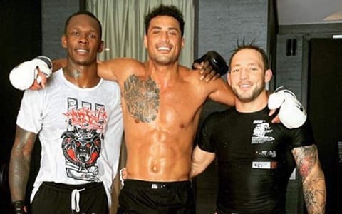 Carlos Ulberg, middle, with City Kickboxing team-mates Israel Adesanya and Brad Riddell.