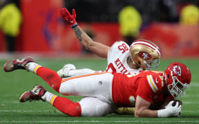 LAS VEGAS, NEVADA - FEBRUARY 11: George Karlaftis #56 of the Kansas City Chiefs recovers a fumble in the first quarter against the San Francisco 49ers during Super Bowl LVIII at Allegiant Stadium on February 11, 2024 in Las Vegas, Nevada.   Jamie Squire/Getty Images/AFP (Photo by JAMIE SQUIRE / GETTY IMAGES NORTH AMERICA / Getty Images via AFP)