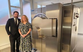 Andrew Bell and Deborah Richards with the "Resomator" - the machine used for water cremations.