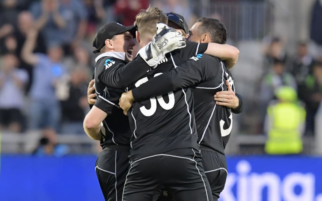 New Zealand players celebrate with New Zealand's James Neesham (C) after he takes the final wicket of West Indies' Carlos Brathwaite during the 2019 Cricket World Cup group stage match between West Indies and New Zealand at Old Trafford in Manchester.