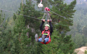 Christchurch Mayor Phil Mauger on Christchurch Adventure Park's zipline on March 22, 2024, the day the park reopened following the Port Hills fire.