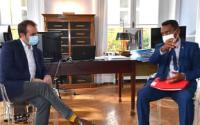 Sebastien Lecornu (left) in talks with Teraii Alpha