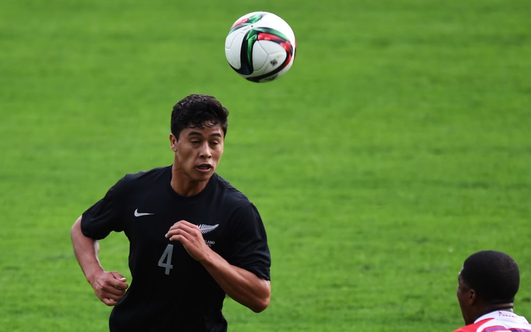 Moses Dyer heads a ball for the Junior All Whites against Panama