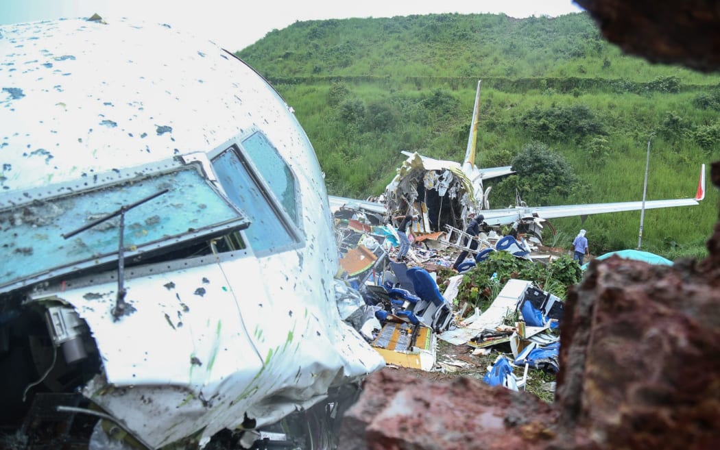 A view of the Air India Express plane crashed in Kerala, India, on August 8, 2020. An Air India Express plane with 190 people on board has crashed at an airport in the southern state of Kerala,