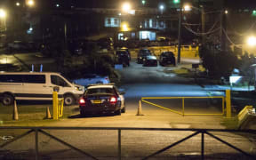 A police vehicle enters the Guam Department of Corrections compound during an early morning Drug raid that saw several prison officials arrested. Thursday August 24.