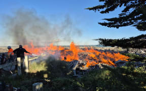 A driftwood fire on the beach in Rangitata Huts, on the coast north of Tīmaru.