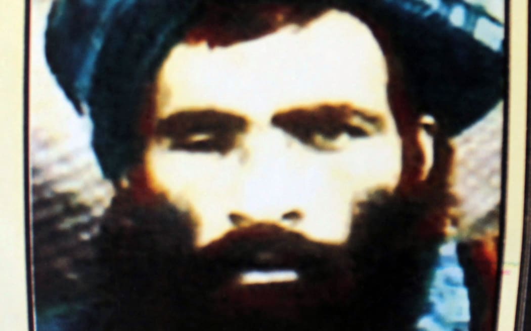 This picture taken in Kandahar on July 31, 2015 shows a calender bearing the image of the Afghan Taliban's deceased leader Mullah Omar.