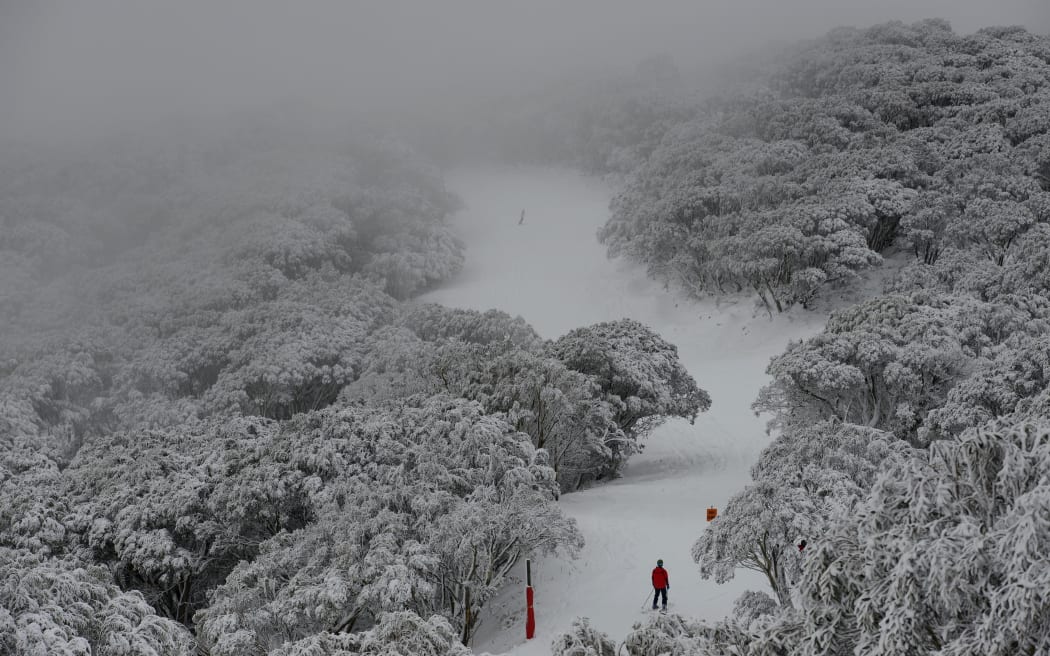 Skiers enjoy the wintery weather as snow blankets Falls Creek ski field, north of Melbourne.