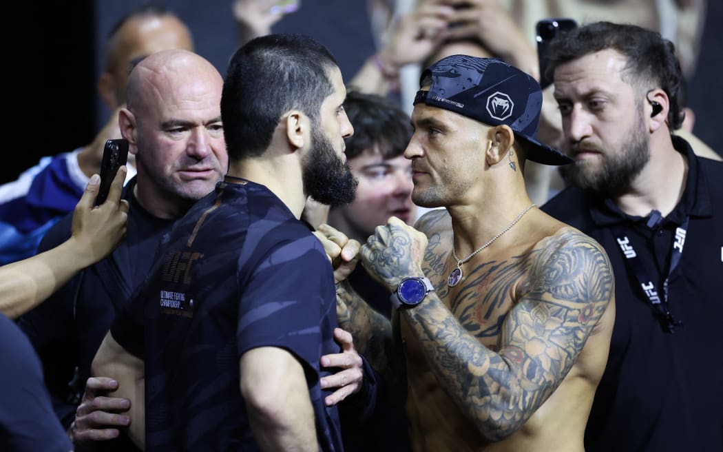Islam Makhachev faces off with Dustin Poirier during the UFC 302 Ceremonial Weigh-in.