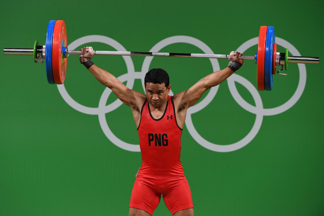 Papua New Guinea's Morea Baru competes during the Men's 62kg weightlifting competition at the Rio 2016 Olympic Games.