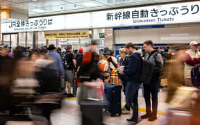 Foreign tourists gather at Kyoto station on April 16, 2025. (Photo by Philip FONG / AFP)