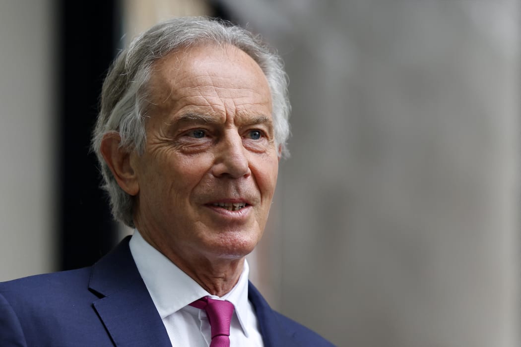 Former British Prime Minister Tony Blair, wearing a face covering due to Covid-19, leaves the BBC in central London on June 6, 2021, after appearing on the BBC political programme The Andrew Marr Show.